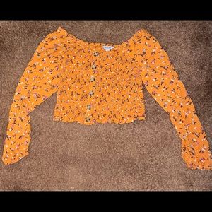 medium orange floral long-sleeved shirt